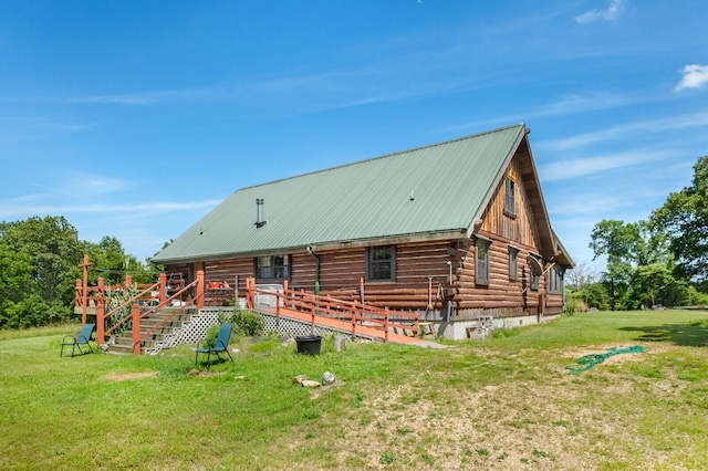 447 Flint Ln, Washburn, MO 65772 - rear view of house featuring log siding, a lawn, a deck, and metal roof