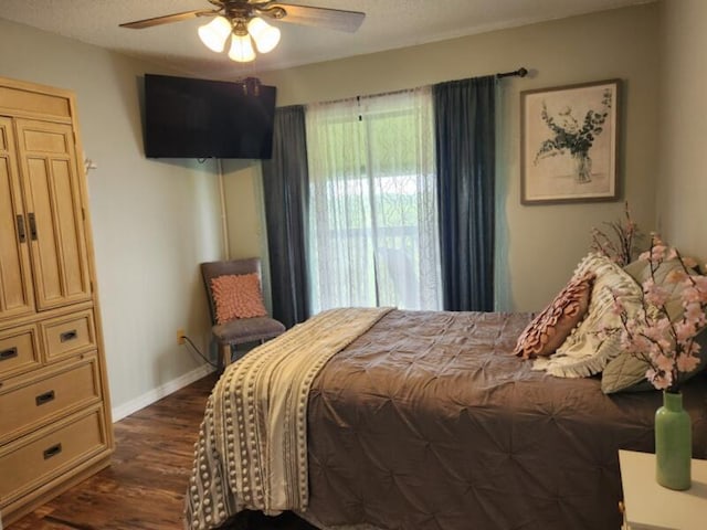 388 Notch Ln Unit 12, Branson West, MO 65737 - bedroom with dark wood-style flooring, baseboards, and ceiling fan