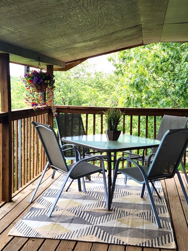 388 Notch Ln Unit 12, Branson West, MO 65737 - wooden terrace featuring outdoor dining space
