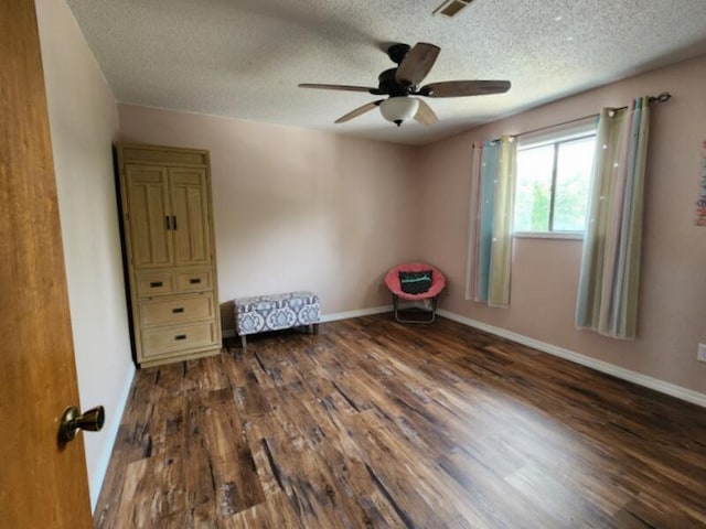 388 Notch Ln Unit 12, Branson West, MO 65737 - empty room featuring a textured ceiling, wood finished floors, ceiling fan, and baseboards
