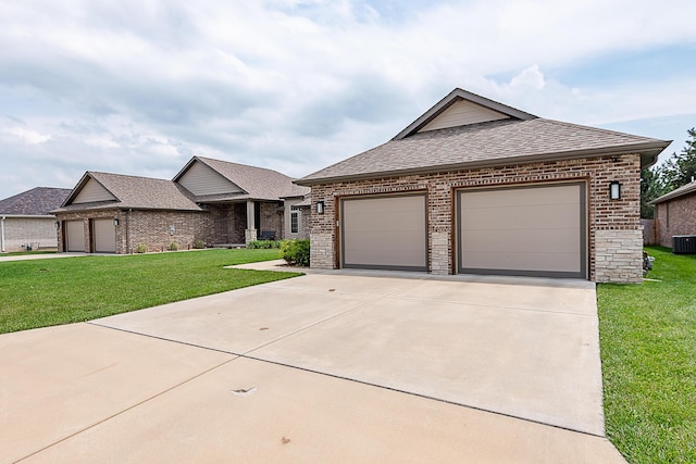 2370 E Cardinal St, Springfield, MO 65804 - view of front of property featuring brick siding, roof with shingles, a front yard, and central air condition unit