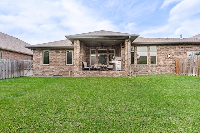 2370 E Cardinal St, Springfield, MO 65804 - rear view of property with ceiling fan, crawl space, brick siding, roof with shingles, and a patio