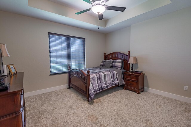 2370 E Cardinal St, Springfield, MO 65804 - bedroom featuring a raised ceiling, light carpet, baseboards, and ceiling fan