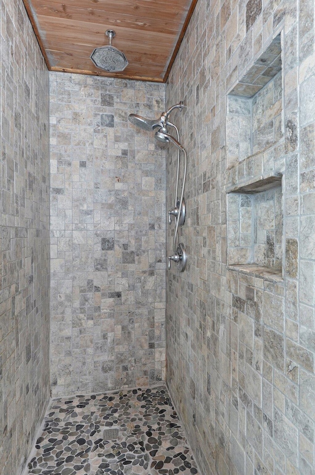 1132 Irene Ct, Nixa, MO 65714 - bathroom featuring stone flooring, wooden ceiling, tiled shower, and ornamental molding