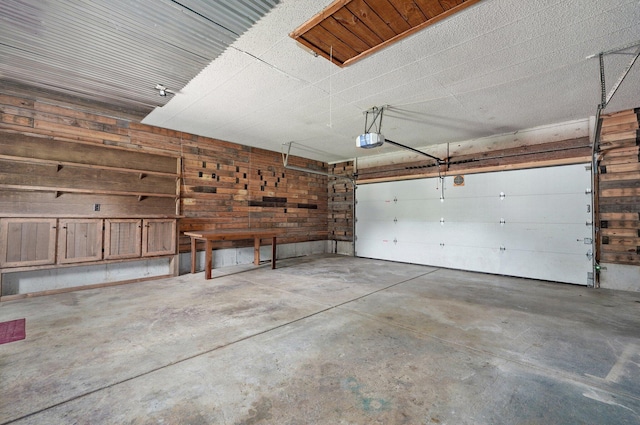 1132 Irene Ct, Nixa, MO 65714 - garage with a garage door opener and wood walls