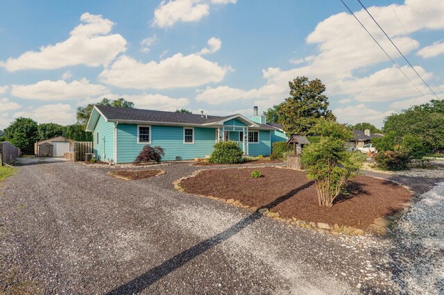 1132 Irene Ct, Nixa, MO 65714 - ranch-style home with an outdoor structure, gravel driveway, and a garage