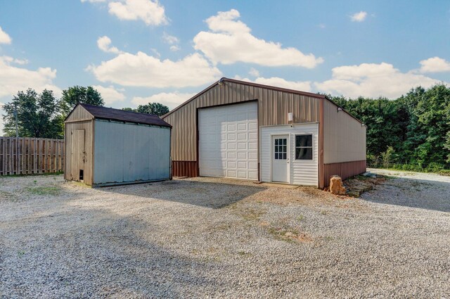 1132 Irene Ct, Nixa, MO 65714 - detached garage featuring gravel driveway