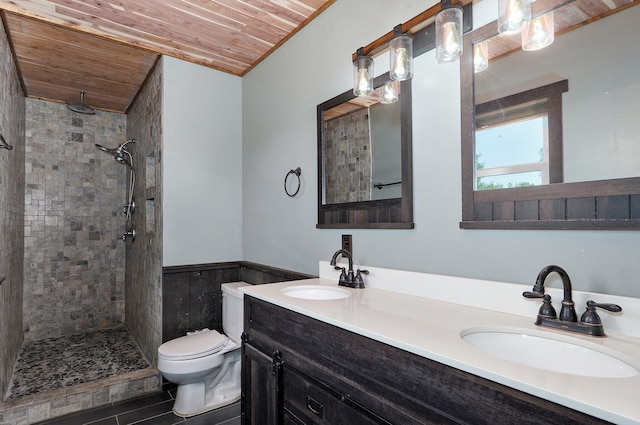 1132 Irene Ct, Nixa, MO 65714 - full bathroom featuring wood ceiling, toilet, a tile shower, double vanity, and wainscoting