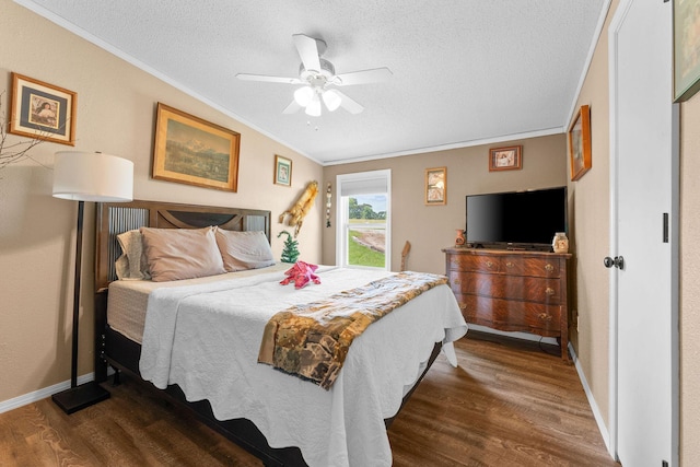 28286 Clay Rd, Eagle Rock, MO 65641 - bedroom with ornamental molding, wood finished floors, a textured ceiling, baseboards, and ceiling fan