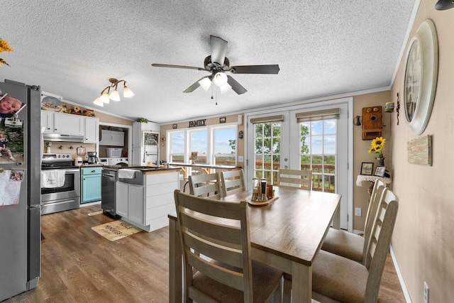 28286 Clay Rd, Eagle Rock, MO 65641 - dining room with a textured ceiling, a ceiling fan, dark wood-style floors, and lofted ceiling