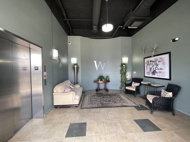 community lobby featuring a towering ceiling