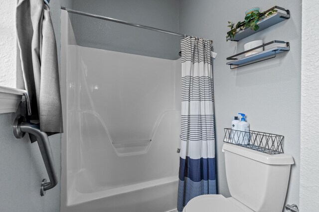 690 Fall Creek Dr Unit 5, Branson, MO 65616 - bathroom with toilet and shower / tub combo with curtain