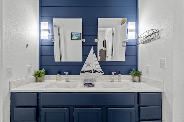 690 Fall Creek Dr Unit 5, Branson, MO 65616 - bathroom with double vanity and a textured wall