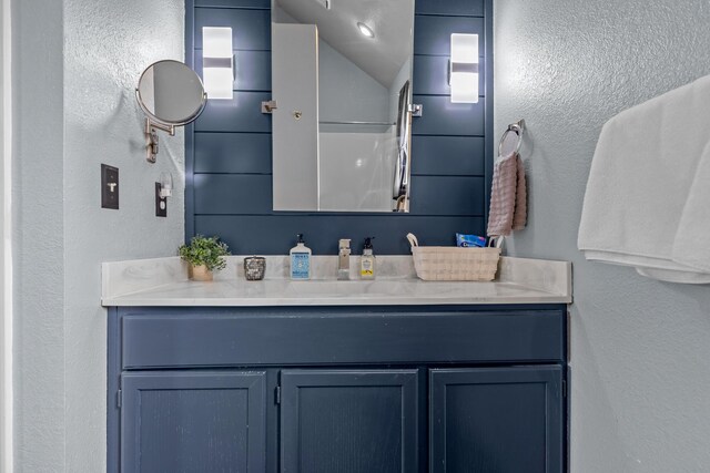 690 Fall Creek Dr Unit 5, Branson, MO 65616 - bathroom featuring vanity and a textured wall
