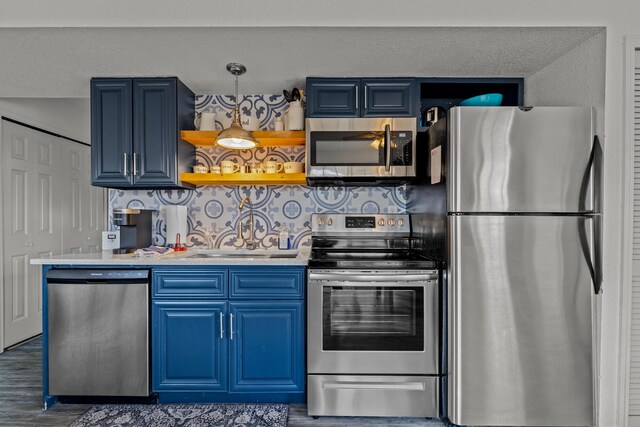 690 Fall Creek Dr Unit 5, Branson, MO 65616 - kitchen featuring appliances with stainless steel finishes, blue cabinets, light countertops, and wood finished floors