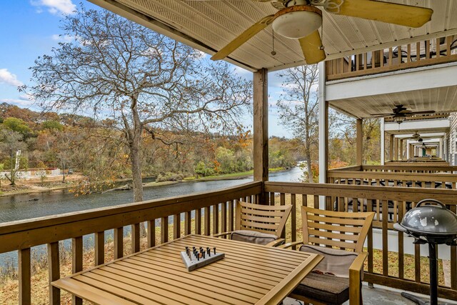 690 Fall Creek Dr Unit 5, Branson, MO 65616 - wooden deck with a ceiling fan, a water view, a grill, and outdoor dining area