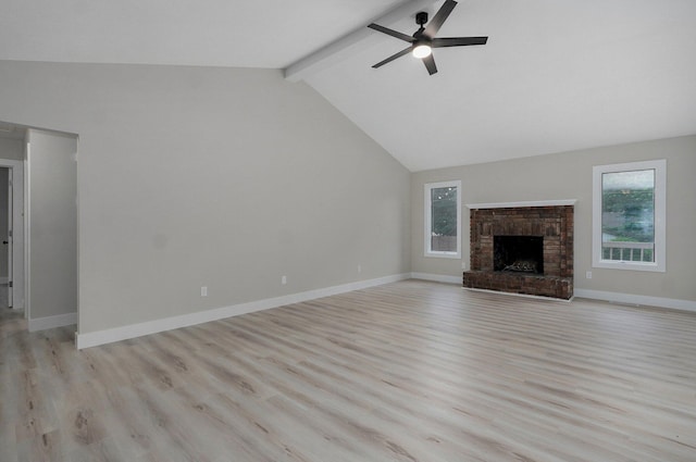 1436 W Whiteside St, Springfield, MO 65807 - unfurnished living room with a ceiling fan, light wood finished floors, a brick fireplace, and baseboards