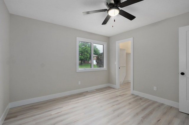 1436 W Whiteside St, Springfield, MO 65807 - unfurnished bedroom featuring light wood finished floors, baseboards, and a ceiling fan