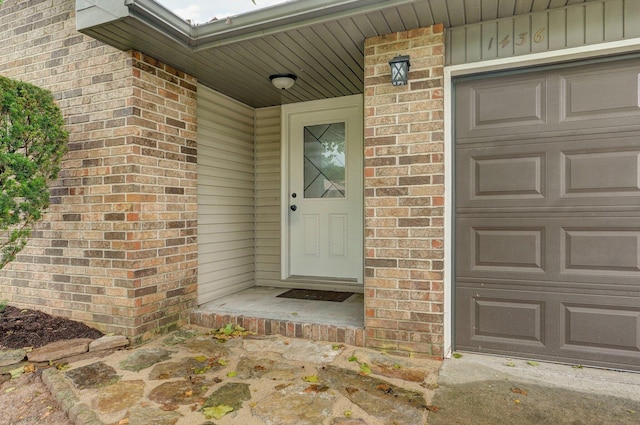 1436 W Whiteside St, Springfield, MO 65807 - entrance to property featuring brick siding and an attached garage