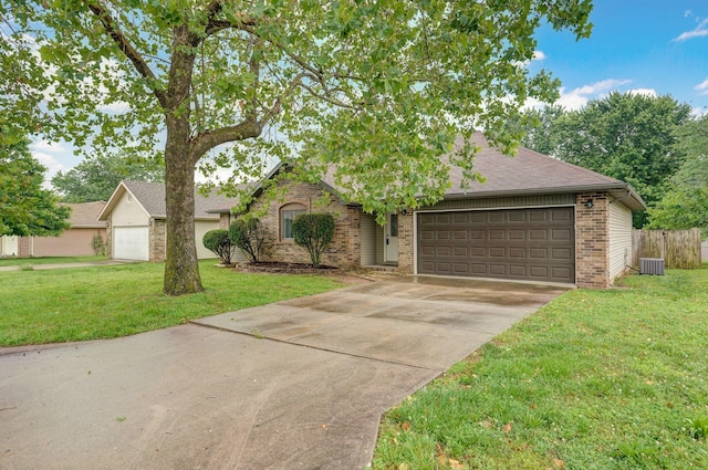 1436 W Whiteside St, Springfield, MO 65807 - view of front of house featuring brick siding, an attached garage, concrete driveway, roof with shingles, and central AC
