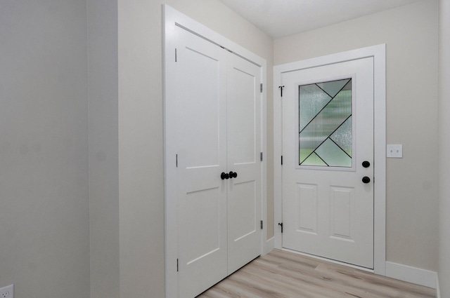 1436 W Whiteside St, Springfield, MO 65807 - doorway featuring light wood-style floors and baseboards