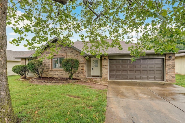 1436 W Whiteside St, Springfield, MO 65807 - single story home featuring brick siding, a garage, concrete driveway, and a front lawn