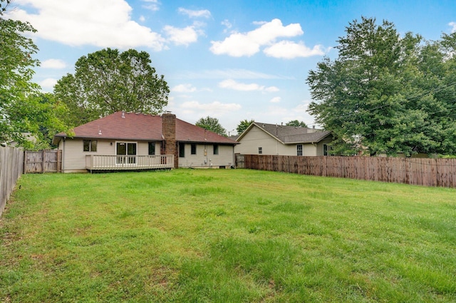 1436 W Whiteside St, Springfield, MO 65807 - rear view of house with a chimney and a wooden deck