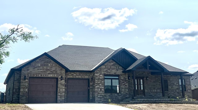 1691 S Charles Pl, Bolivar, MO 65613 - view of front of house featuring brick siding, concrete driveway, an attached garage, and board and batten siding
