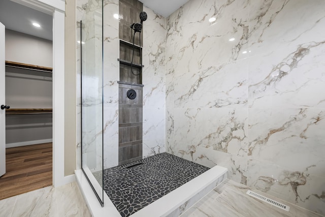 1691 S Charles Pl, Bolivar, MO 65613 - full bath with a marble finish shower, a walk in closet, recessed lighting, and marble tiled floors