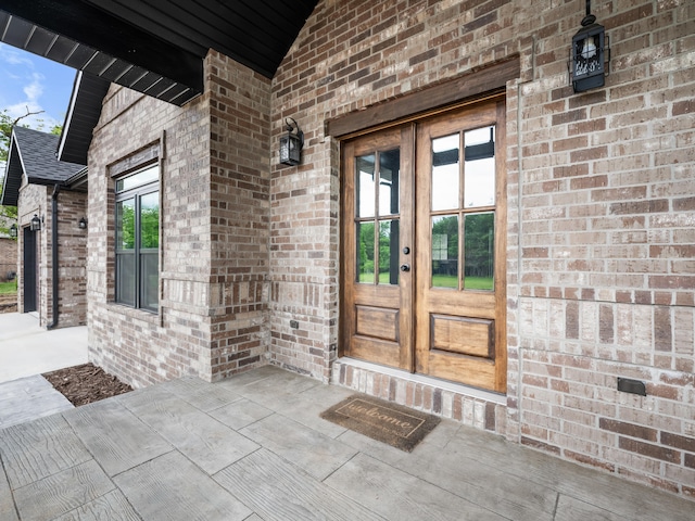 1691 S Charles Pl, Bolivar, MO 65613 - entrance to property with french doors and brick siding