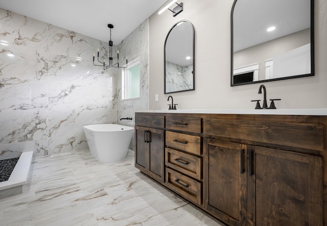 1691 S Charles Pl, Bolivar, MO 65613 - full bath with double vanity, marble finish flooring, a freestanding tub, a marble finish shower, and a chandelier