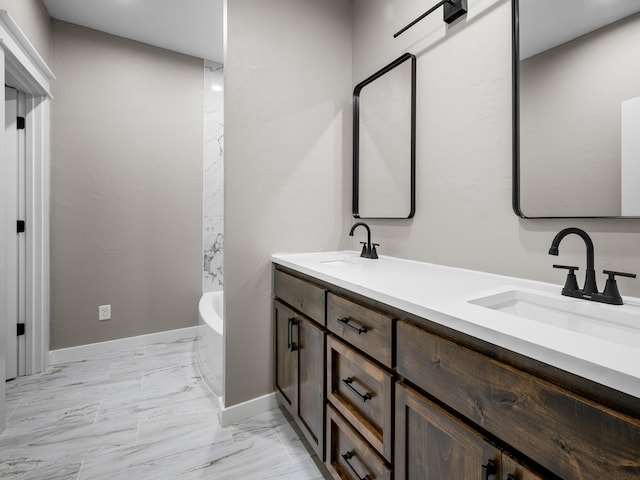 1691 S Charles Pl, Bolivar, MO 65613 - full bathroom with a soaking tub, double vanity, marble look tile flooring, and baseboards