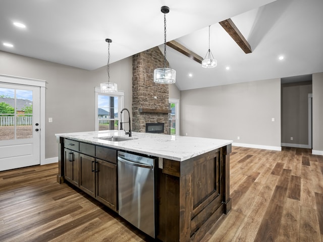 1691 S Charles Pl, Bolivar, MO 65613 - kitchen with stainless steel dishwasher, a sink, open floor plan, wood finished floors, and recessed lighting