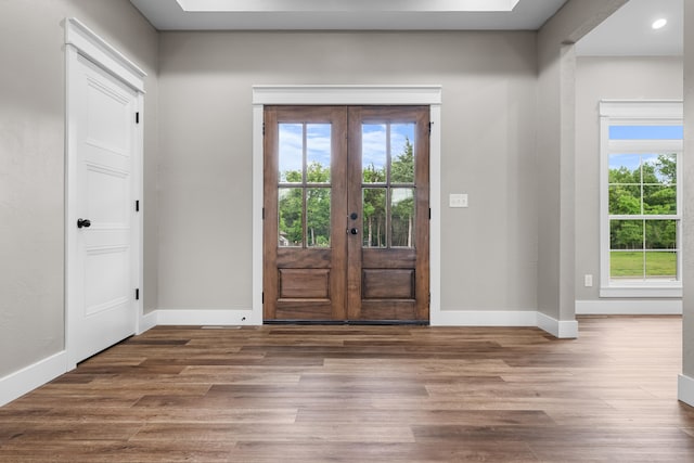 1691 S Charles Pl, Bolivar, MO 65613 - foyer featuring healthy amount of natural light, wood finished floors, baseboards, and french doors