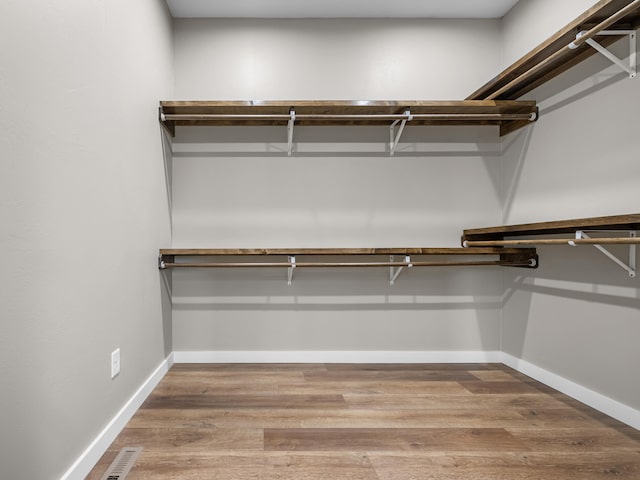 1691 S Charles Pl, Bolivar, MO 65613 - spacious closet featuring wood finished floors
