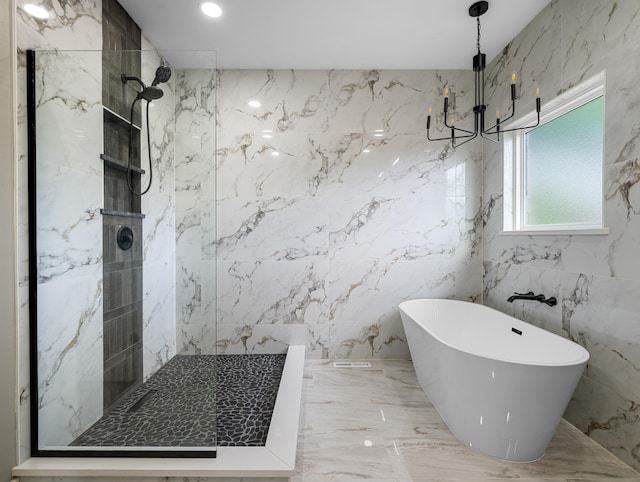 1691 S Charles Pl, Bolivar, MO 65613 - bathroom featuring a chandelier, a marble finish shower, a freestanding tub, and marble tiled floors