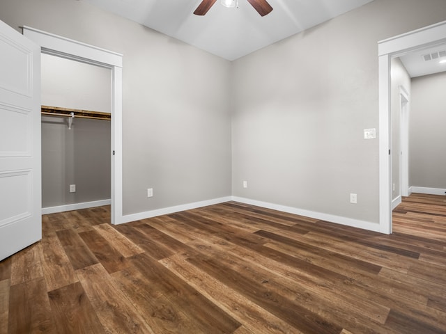 1691 S Charles Pl, Bolivar, MO 65613 - unfurnished bedroom with wood finished floors, baseboards, a closet, and a ceiling fan