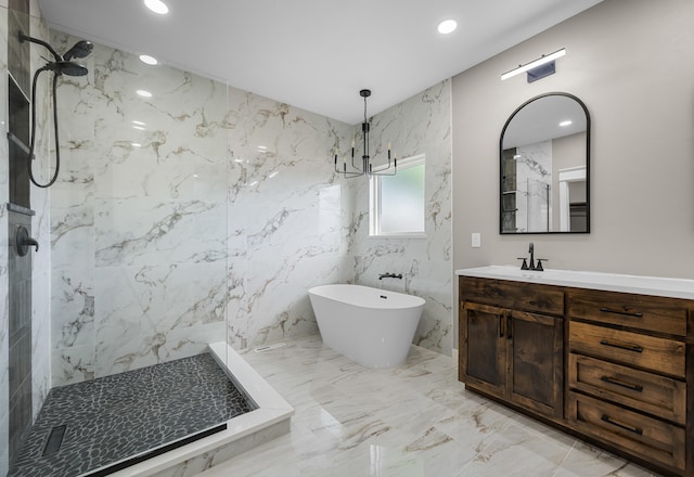 1691 S Charles Pl, Bolivar, MO 65613 - full bath featuring a marble finish shower, vanity, marble tiled flooring, a freestanding bath, and a chandelier