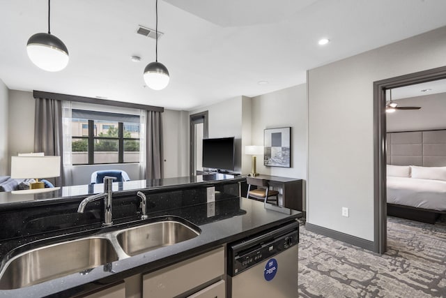 2204A Branson Landing Blvd, Branson, MO 65616 - kitchen featuring stainless steel dishwasher, open floor plan, a sink, pendant lighting, and dark stone countertops