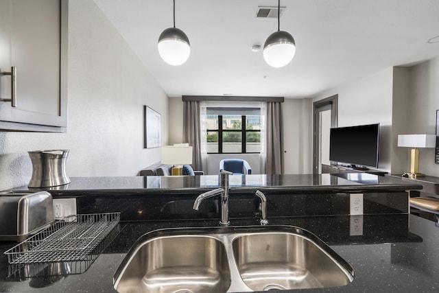 2204A Branson Landing Blvd, Branson, MO 65616 - kitchen featuring a sink and dark stone counters