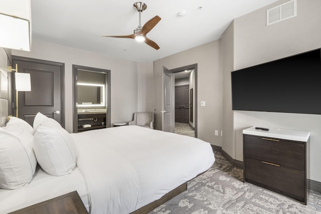 2204A Branson Landing Blvd, Branson, MO 65616 - bedroom featuring light colored carpet, ensuite bathroom, baseboards, and ceiling fan