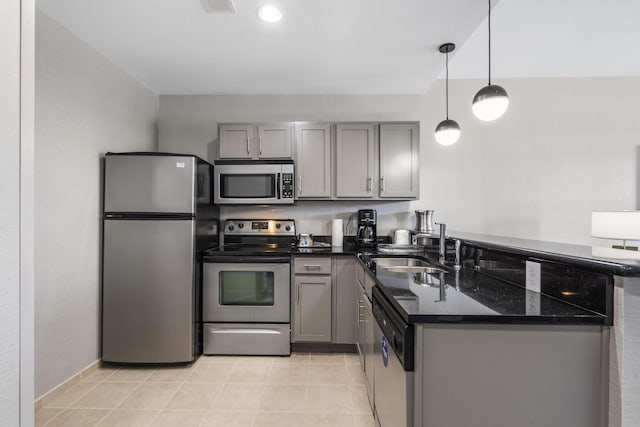 2204A Branson Landing Blvd, Branson, MO 65616 - kitchen featuring stainless steel appliances, gray cabinetry, a peninsula, dark stone counters, and a sink