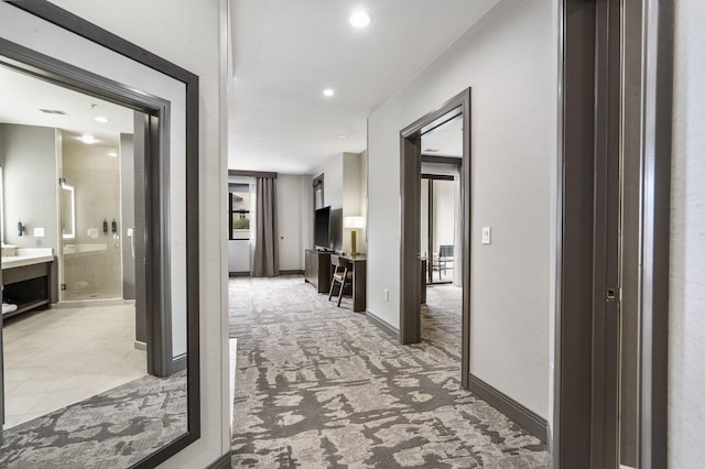 2204A Branson Landing Blvd, Branson, MO 65616 - hall with light colored carpet, baseboards, and recessed lighting