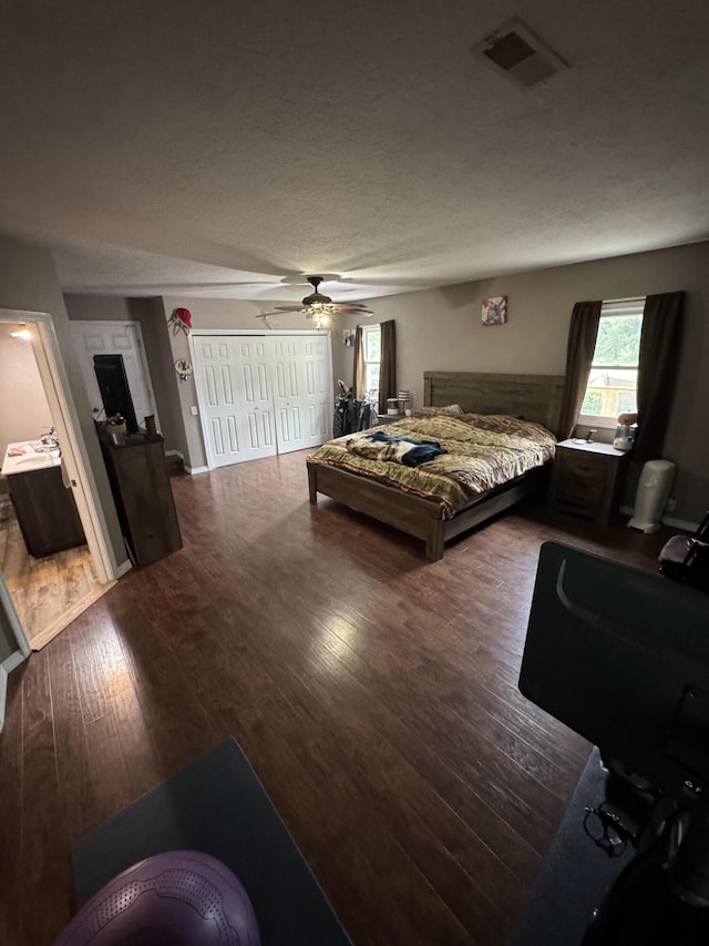 9153 N Hwy Highway, Mountain Grove, MO 65711 - bedroom with wood finished floors, ceiling fan, and a textured ceiling