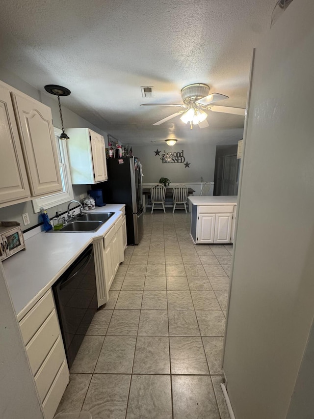9153 N Hwy Highway, Mountain Grove, MO 65711 - kitchen with black dishwasher, a sink, a textured ceiling, ceiling fan, and white cabinetry