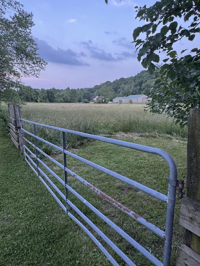 9153 N Hwy Highway, Mountain Grove, MO 65711 - yard at dusk featuring a rural view