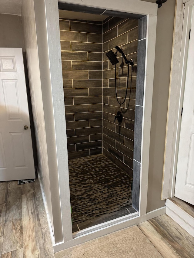 9153 N Hwy Highway, Mountain Grove, MO 65711 - bathroom with a shower stall, wood finished floors, and baseboards