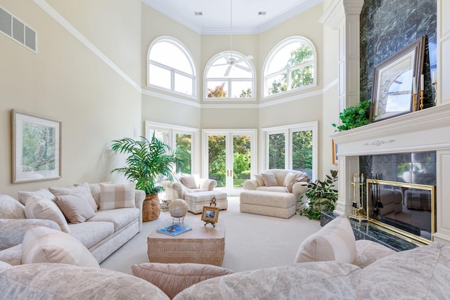193 Honeybee Dr, Branson, MO 65615 - living area with a towering ceiling, a fireplace, plenty of natural light, and ornamental molding