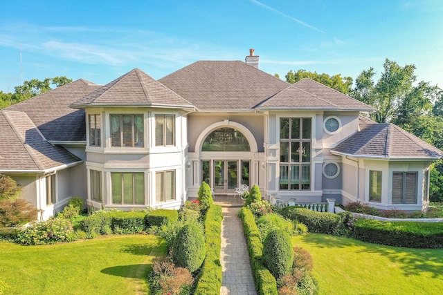 193 Honeybee Dr, Branson, MO 65615 - back of house with stucco siding, a chimney, a yard, and french doors