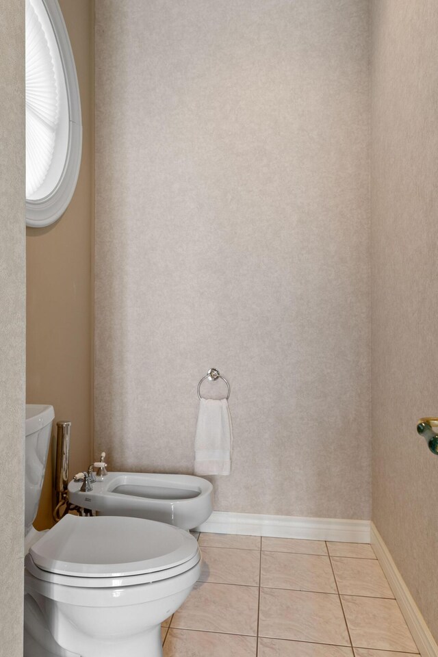 193 Honeybee Dr, Branson, MO 65615 - bathroom with a bidet, toilet, and tile patterned flooring